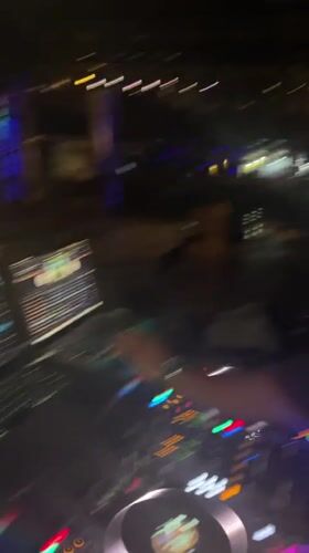 Late-night DJ set and crowd at a Howayi venue