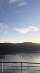 Boat passenger films calm waters near Divnogorsk, Russia