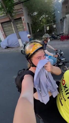 Scooter ride through busy Nha Trang street captured