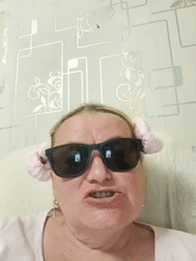 Woman in pink accessories recorded indoors in Russian town