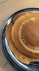 Man cooks pancakes in Pernik kitchen Tuesday morning
