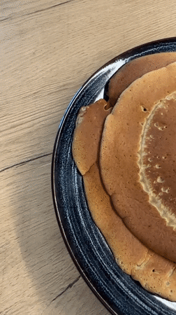 Man cooks pancakes in Pernik kitchen Tuesday morning
