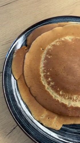 Man cooks pancakes in Pernik kitchen Tuesday morning