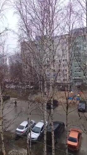 Rainy day residential courtyard observed in Nizhnevartovsk, Russia