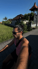 Man rides red scooter on North Kuta road