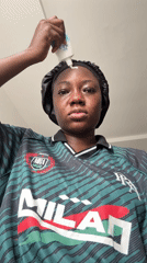 Woman documents skincare routine in Nigerian neighborhood