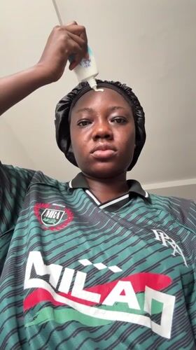 Woman documents skincare routine in Nigerian neighborhood