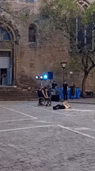 Contemporary dancers perform wheelchair routine in Barcelona square