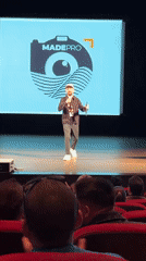 Man gives presentation at Pomorie theater with visual slides