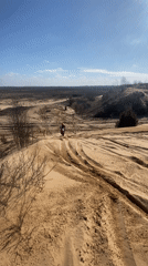 Dirt bikers traverse sandy dunes near Privalka, Belarus