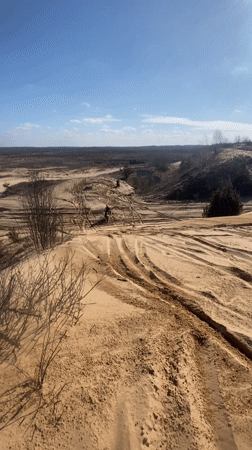 Dirt bikers traverse sandy dunes near Privalka, Belarus