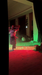 Two women dance on lit stage in Nova Zagora
