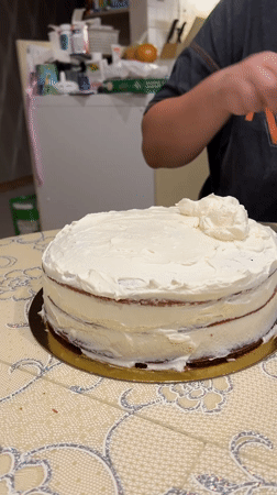 Red velvet cake assembled and frosted in Yekaterinburg kitchen