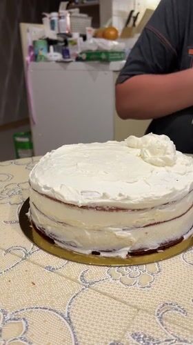 Red velvet cake assembled and frosted in Yekaterinburg kitchen