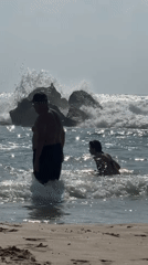 Lazy beach day meets choppy surf and rocky shoreline