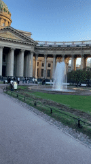 Saint Petersburg cafe patrons witness golden hour at Kazan Cathedral