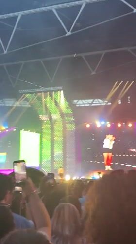 Live concert night at a London stadium, crowd in full swing