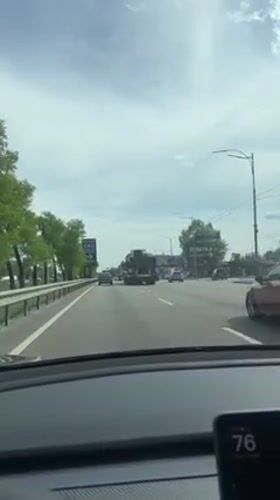 Driver records routine travel on Ukrainian road during overcast day