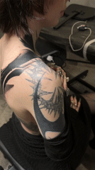 Heavily tattooed person observed seated in Moscow