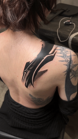 Heavily tattooed person observed seated in Moscow