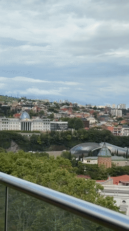 Tourist captures Tbilisi landmarks and indoor entertainment venues