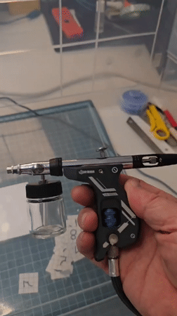 Hobbyist documents video game restoration session with airbrush equipment