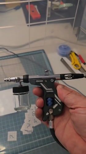 Hobbyist documents video game restoration session with airbrush equipment