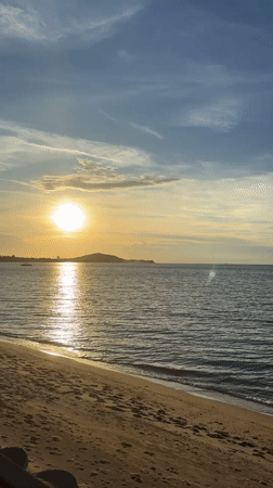 Tourist captures sunset beach moments in Baan Bo Phut Thailand