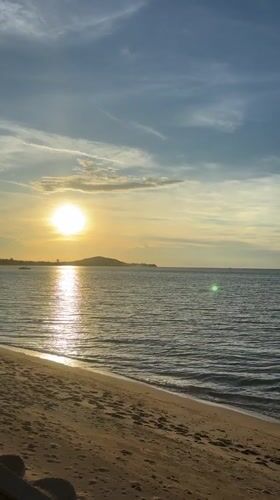 Tourist captures sunset beach moments in Baan Bo Phut Thailand