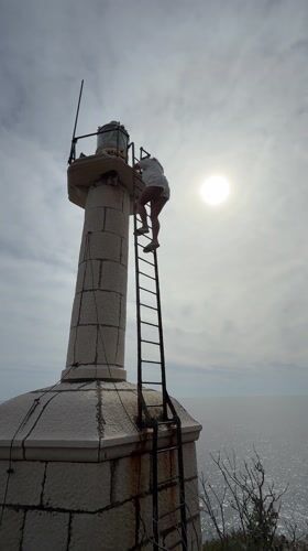 Woman climbs stone lighthouse, takes selfie in Montenegro