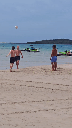 Morning beach soccer and vendor activity in Baan Chaweng