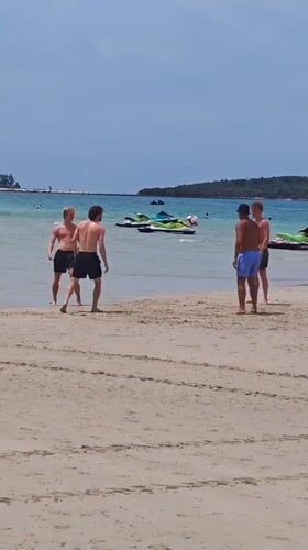 Morning beach soccer and vendor activity in Baan Chaweng