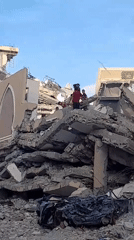Children gather amid rubble in Khan Yunis devastation scene