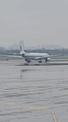 Air China A330 on wet tarmac at Hangzhou Xiaoshan Airport