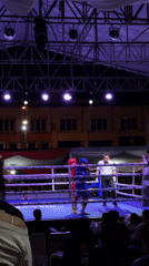Outdoor boxing and fireworks mark a nighttime event in Manado