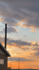 Dramatic sunset documented over wooden cabin in Pchelnik, Bulgaria
