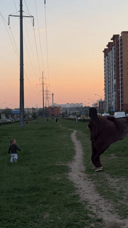 Woman and child walk dirt path in Odintsovo