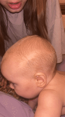 Moscow household moments: girl with baby, cats indoors