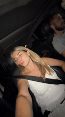 Passenger talking to camera during a nighttime drive in Podgorica