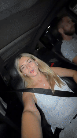 Passenger talking to camera during a nighttime drive in Podgorica