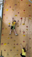 Girl practices indoor rock climbing at Izhevsk recreation center