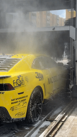 Yellow Camaro gets car wash in Monopoli, Italy