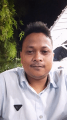 Man takes nighttime selfies outdoors in Lhokseumawe, Indonesia