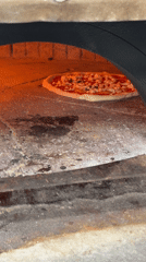 Full kitchen in motion: pizza, espresso, and prep work in Palmanova