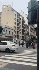 Protesters display 'social crime' banner at Buenos Aires intersection