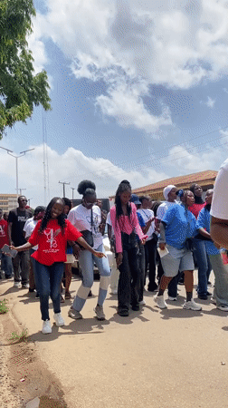 Nurses' procession marches through Jos streets with banners and matching shirts