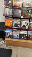 Woman takes selfie in music and shoe store in Bulgaria