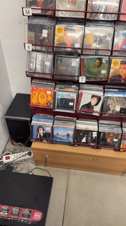 Woman takes selfie in music and shoe store in Bulgaria