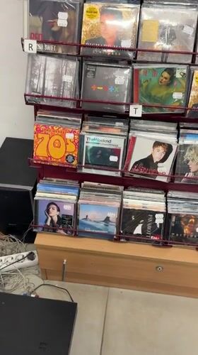 Woman takes selfie in music and shoe store in Bulgaria