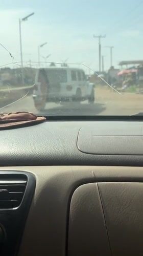 Ambulance spotted on Nigerian road through cracked windshield